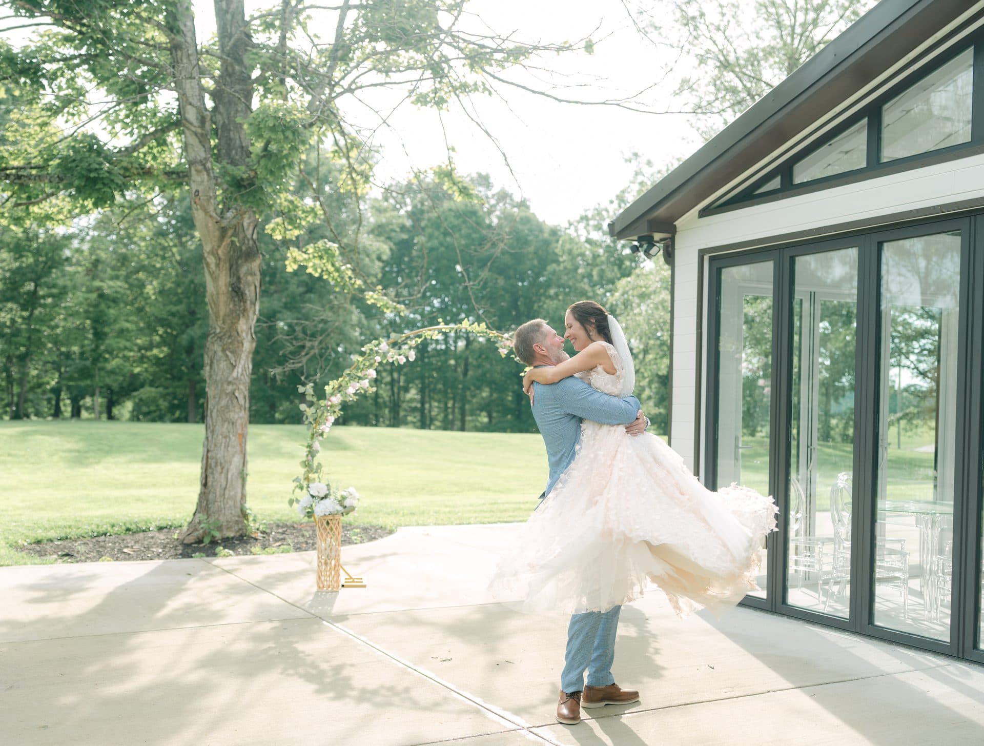 A couple celebrating beside the Pavilion