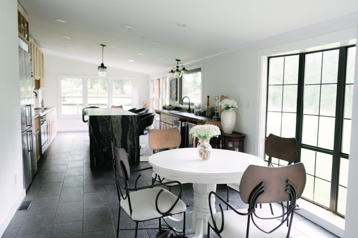 Cabin kitchen and dining, black-framed windows